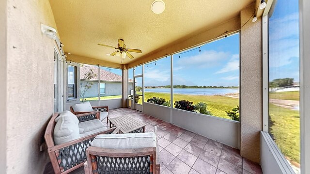 632 Tanana Fall Dr, Ruskin, FL 33570 - sunroom with a ceiling fan, a water view, and healthy amount of natural light