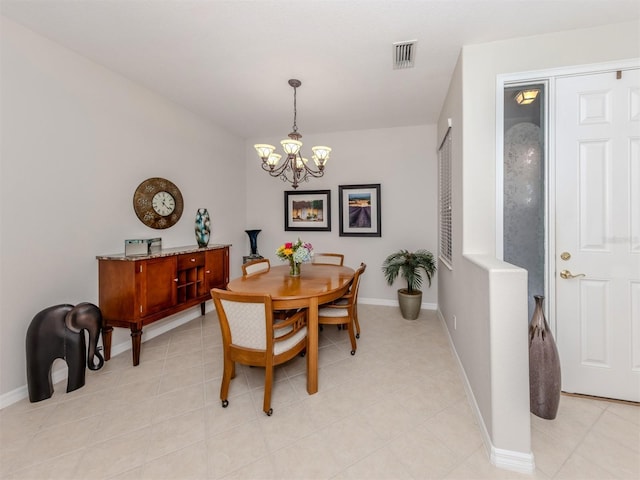 165 Tiziano Way N, Venice, FL 34275 - dining space with a chandelier, baseboards, and light tile patterned floors