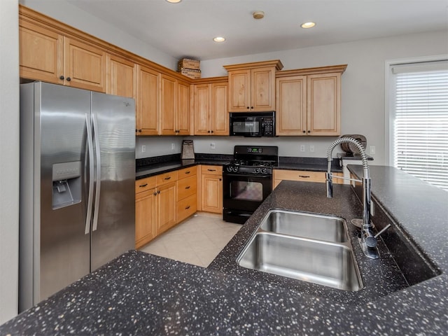 165 Tiziano Way N, Venice, FL 34275 - kitchen featuring black appliances, a sink, recessed lighting, dark stone countertops, and light tile patterned floors