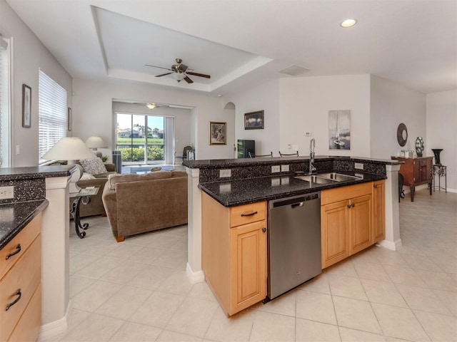 165 Tiziano Way N, Venice, FL 34275 - kitchen featuring stainless steel dishwasher, a sink, open floor plan, a ceiling fan, and light tile patterned flooring