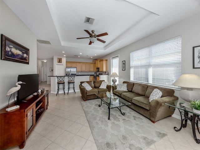 165 Tiziano Way N, Venice, FL 34275 - living room with a raised ceiling, light tile patterned flooring, a ceiling fan, baseboards, and recessed lighting