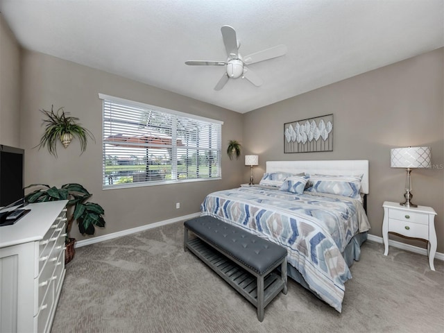 165 Tiziano Way N, Venice, FL 34275 - bedroom with baseboards, light carpet, and ceiling fan