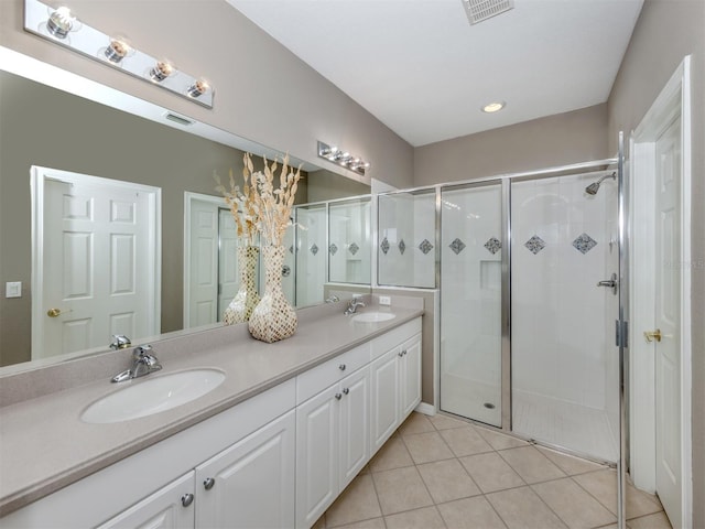 165 Tiziano Way N, Venice, FL 34275 - bathroom with double vanity, a stall shower, and tile patterned flooring