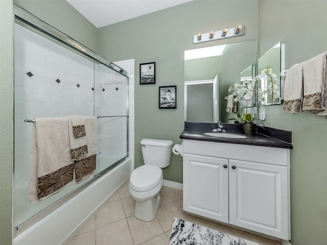 165 Tiziano Way N, Venice, FL 34275 - full bath featuring enclosed tub / shower combo, vanity, toilet, tile patterned floors, and baseboards