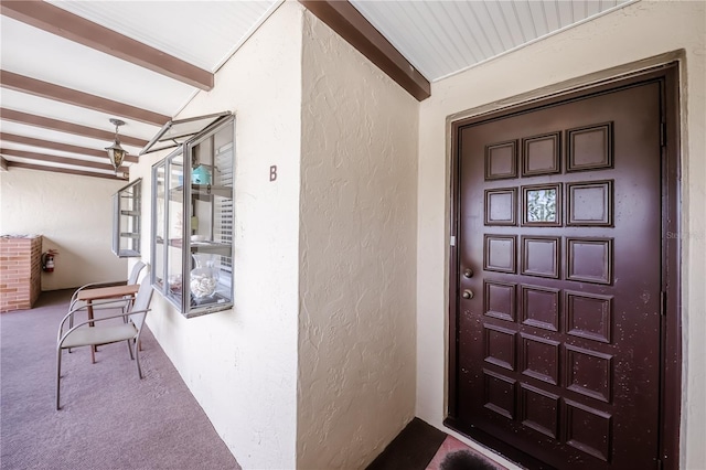 410 Mission Trl E Unit B, Venice, FL 34285 - doorway to property featuring stucco siding