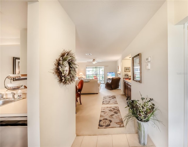 410 Mission Trl E Unit B, Venice, FL 34285 - hallway featuring tile patterned floors and a sink