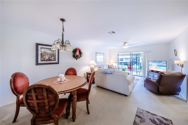 410 Mission Trl E Unit B, Venice, FL 34285 - dining area with light colored carpet, a chandelier, and baseboards