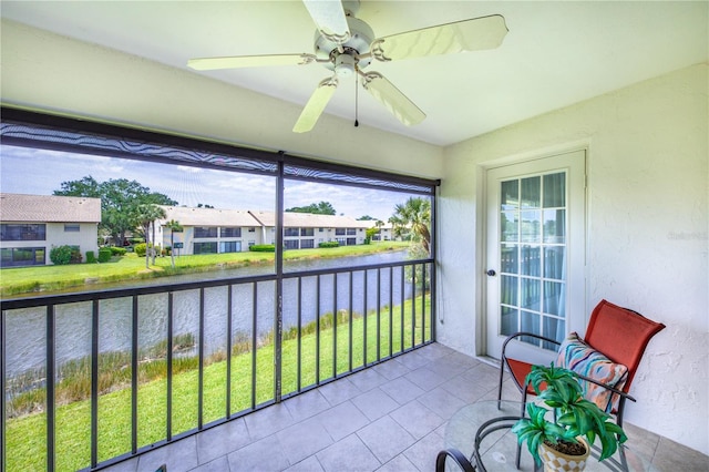 410 Mission Trl E Unit B, Venice, FL 34285 - sunroom featuring a water view and a residential view