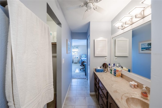 410 Mission Trl E Unit B, Venice, FL 34285 - bathroom featuring vanity, tile patterned floors, baseboards, and a ceiling fan