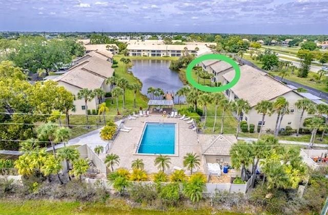 410 Mission Trl E Unit B, Venice, FL 34285 - aerial view of a pool area and a nearby body of water