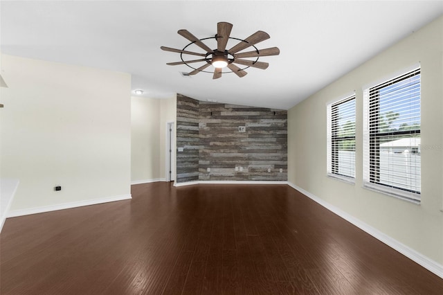 4305 Heyward St, North Port, FL 34291 - unfurnished living room with an accent wall, wood finished floors, baseboards, a ceiling fan, and lofted ceiling
