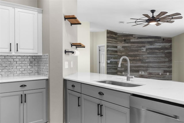 4305 Heyward St, North Port, FL 34291 - kitchen featuring dishwasher, gray cabinets, a sink, backsplash, and light countertops