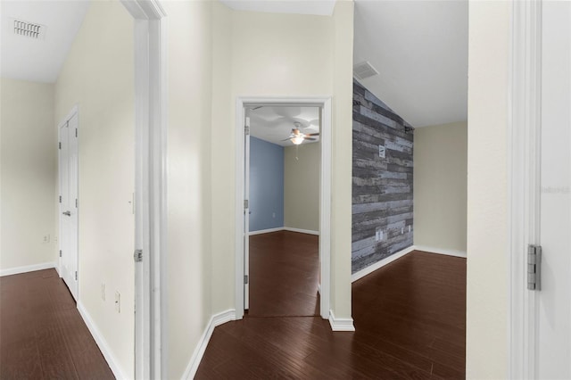 4305 Heyward St, North Port, FL 34291 - hallway with an accent wall, wood finished floors, baseboards, vaulted ceiling, and wallpapered walls