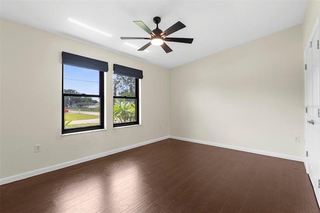 4305 Heyward St, North Port, FL 34291 - empty room featuring ceiling fan, dark wood finished floors, and baseboards