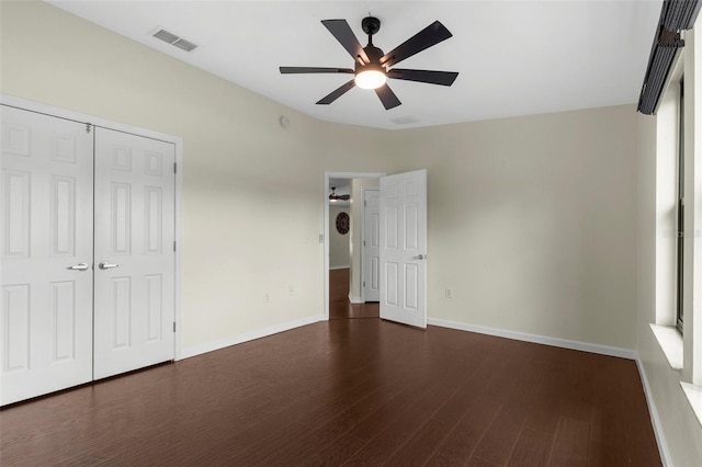 4305 Heyward St, North Port, FL 34291 - unfurnished bedroom with dark wood-style floors, baseboards, a closet, and ceiling fan