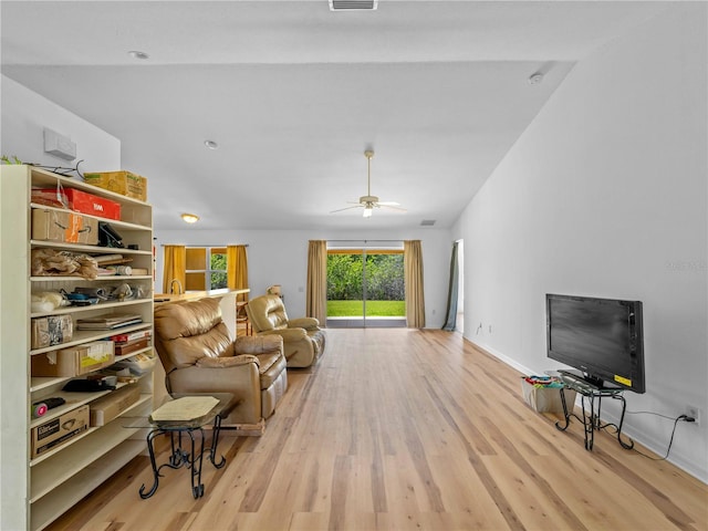 6199 Stamp St, Port Charlotte, FL 33981 - living area featuring light wood finished floors, a ceiling fan, and baseboards