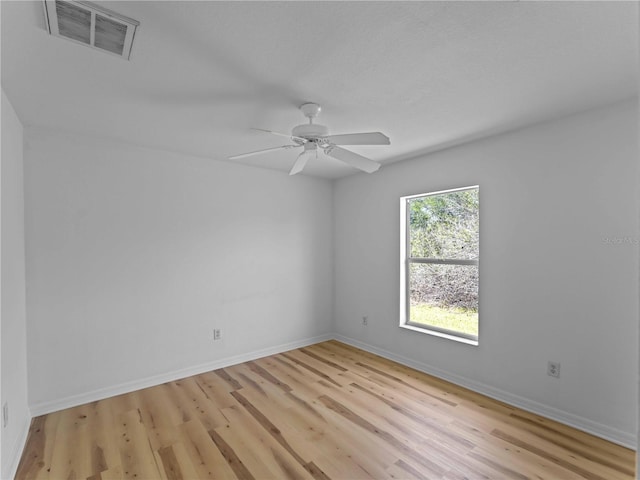 6199 Stamp St, Port Charlotte, FL 33981 - empty room with light wood finished floors, baseboards, and a ceiling fan