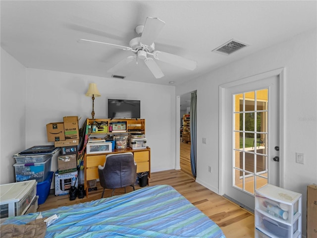 6199 Stamp St, Port Charlotte, FL 33981 - bedroom featuring access to outside, wood finished floors, and ceiling fan