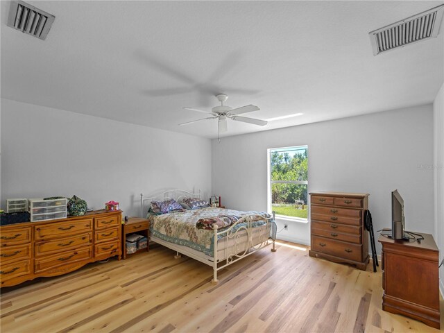 6199 Stamp St, Port Charlotte, FL 33981 - bedroom featuring wood finished floors and ceiling fan