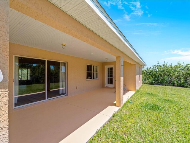 6199 Stamp St, Port Charlotte, FL 33981 - view of grassy yard featuring a patio
