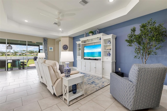 629 Ibiza Loop, Venice, FL 34292 - living area featuring a raised ceiling, ceiling fan, recessed lighting, and light tile patterned floors