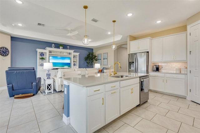 629 Ibiza Loop, Venice, FL 34292 - kitchen featuring stainless steel appliances, a sink, light tile patterned floors, tasteful backsplash, and recessed lighting