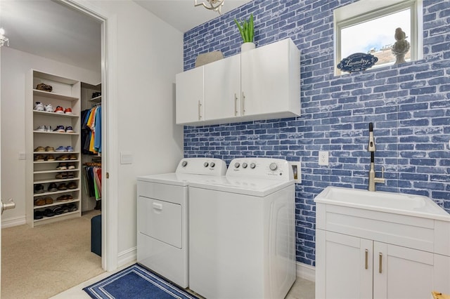 629 Ibiza Loop, Venice, FL 34292 - laundry room with cabinet space, washing machine and clothes dryer, light carpet, and baseboards