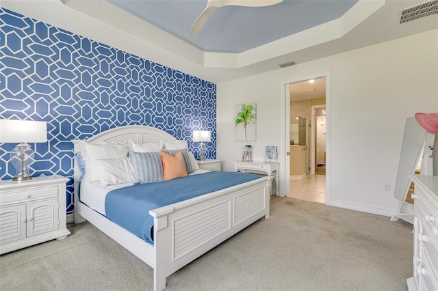 629 Ibiza Loop, Venice, FL 34292 - bedroom featuring light carpet, baseboards, ceiling fan, and a raised ceiling