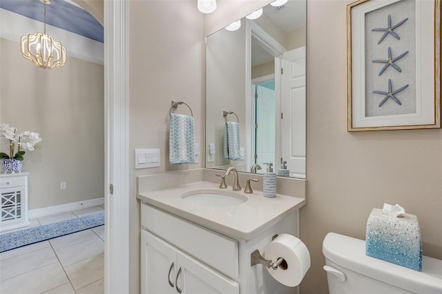 629 Ibiza Loop, Venice, FL 34292 - bathroom featuring vanity, toilet, a chandelier, and tile patterned floors