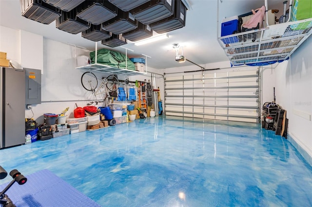 629 Ibiza Loop, Venice, FL 34292 - garage with a garage door opener and electric panel