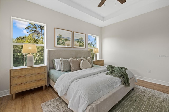 4390 Asteria Ter, North Port, FL 34287 - bedroom featuring wood finished floors, baseboards, and ceiling fan