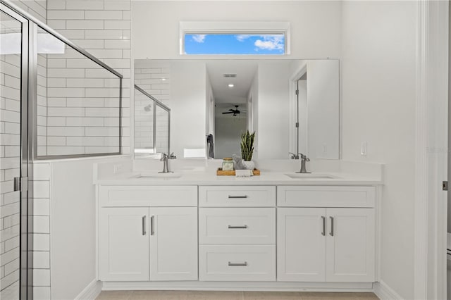 4390 Asteria Ter, North Port, FL 34287 - bathroom featuring a stall shower, double vanity, ceiling fan, and baseboards