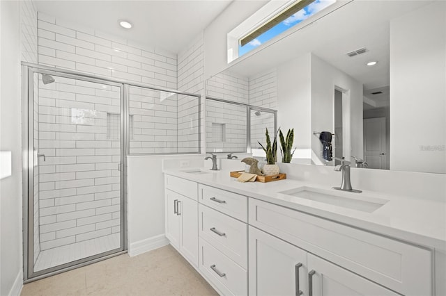 4390 Asteria Ter, North Port, FL 34287 - bathroom featuring a shower stall, double vanity, and recessed lighting