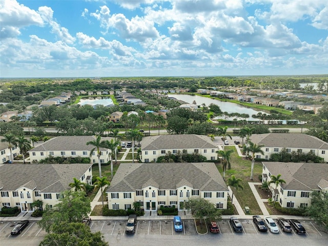 aerial perspective of suburban area with a nearby body of water