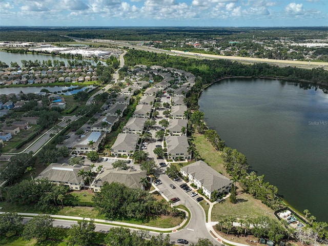 aerial overview of property's location with a large body of water and nearby suburban area