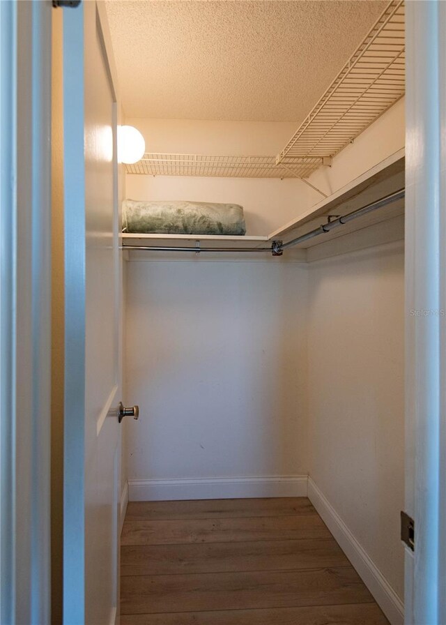 1255 Tarpon Center Dr Unit 604, Venice, FL 34285 - spacious closet featuring wood finished floors