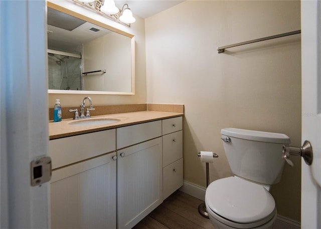1255 Tarpon Center Dr Unit 604, Venice, FL 34285 - bathroom featuring toilet, wood finished floors, baseboards, and vanity
