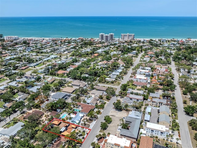 aerial view of property and surrounding area with property boundaries highlighted and a large body of water