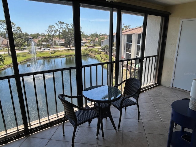 1154 Bird Bay Way Unit 303, Venice, FL 34285 - sunroom / solarium featuring a water view and a residential view