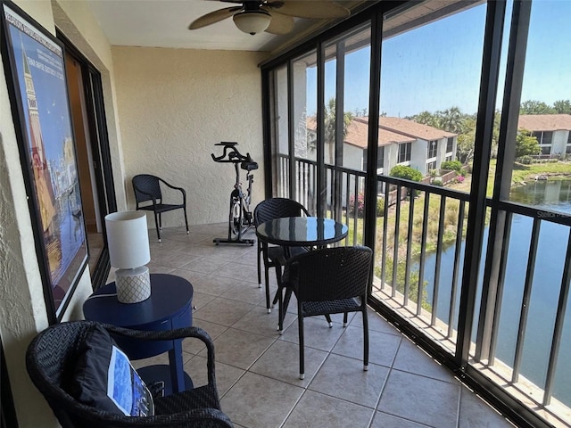 1154 Bird Bay Way Unit 303, Venice, FL 34285 - sunroom / solarium with a ceiling fan, plenty of natural light, and a water view