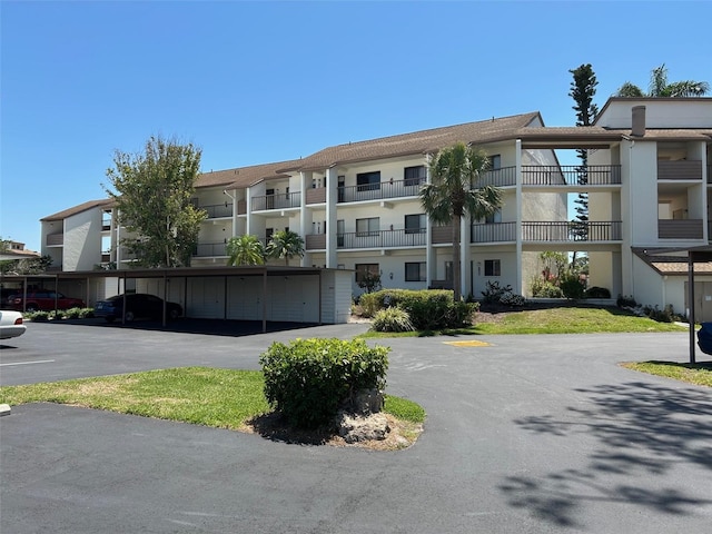 1154 Bird Bay Way Unit 303, Venice, FL 34285 - view of property featuring covered parking