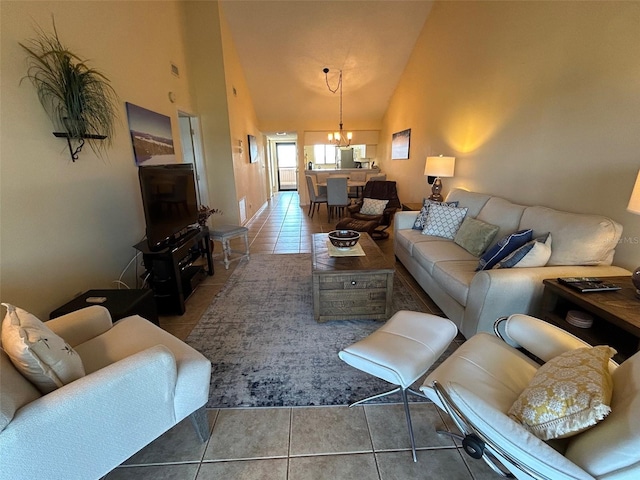 1154 Bird Bay Way Unit 303, Venice, FL 34285 - tiled living area featuring a chandelier and high vaulted ceiling