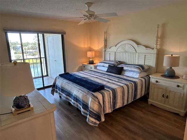 1154 Bird Bay Way Unit 303, Venice, FL 34285 - bedroom with access to exterior, wood finished floors, a textured ceiling, and ceiling fan