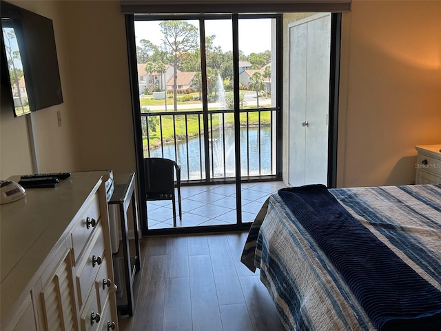 1154 Bird Bay Way Unit 303, Venice, FL 34285 - bedroom with wood finished floors