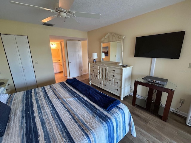 1154 Bird Bay Way Unit 303, Venice, FL 34285 - bedroom with wood finished floors and a ceiling fan