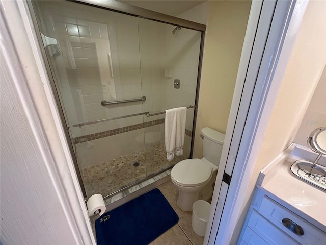 1154 Bird Bay Way Unit 303, Venice, FL 34285 - full bathroom with toilet, a stall shower, vanity, and tile patterned floors