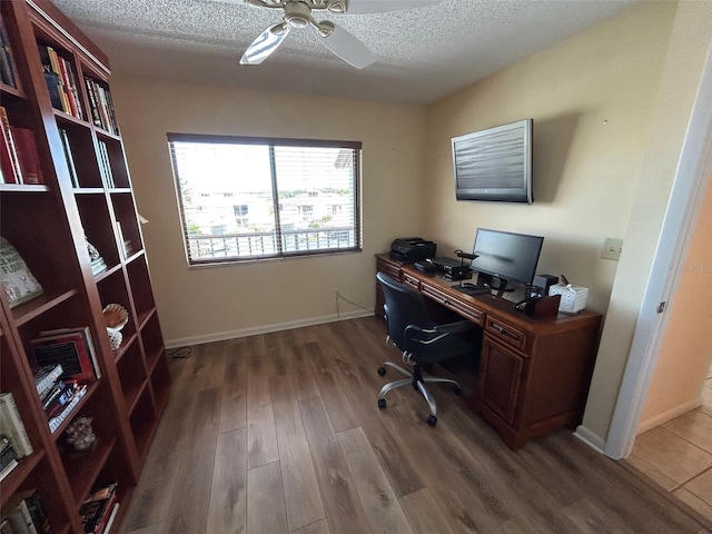 1154 Bird Bay Way Unit 303, Venice, FL 34285 - office featuring wood finished floors, a ceiling fan, a textured ceiling, and baseboards