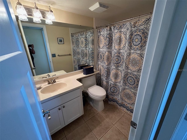 1154 Bird Bay Way Unit 303, Venice, FL 34285 - bathroom with tile patterned floors, toilet, and vanity