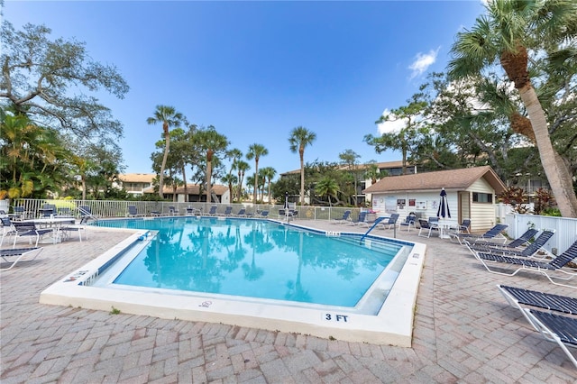 1154 Bird Bay Way Unit 303, Venice, FL 34285 - community pool with fence and a patio area