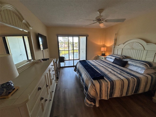 1154 Bird Bay Way Unit 303, Venice, FL 34285 - bedroom featuring access to outside, dark wood-type flooring, a textured ceiling, and ceiling fan